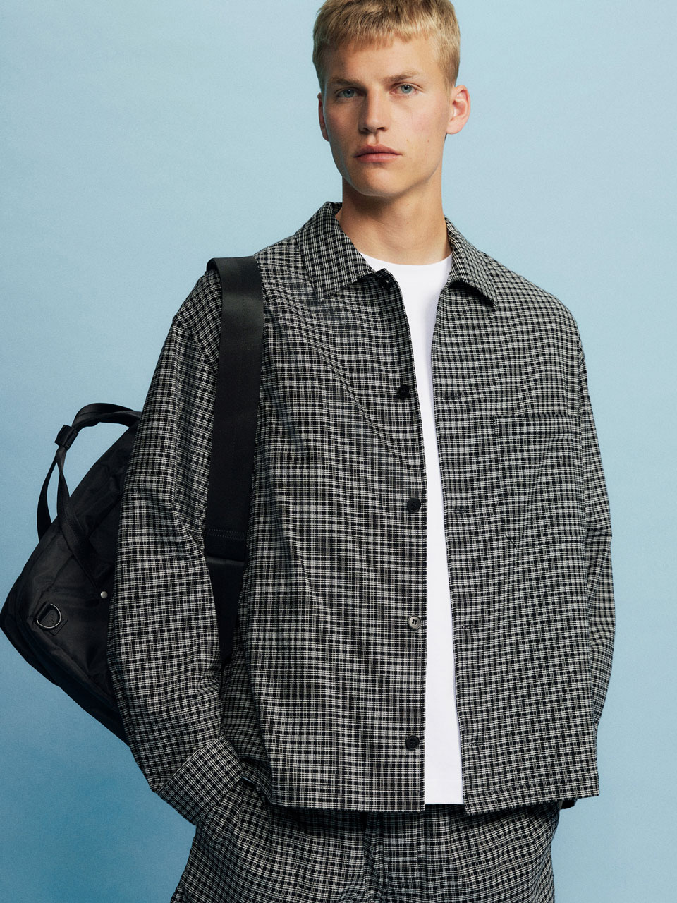 model wearing minimalist Scandinavian design from ARKET